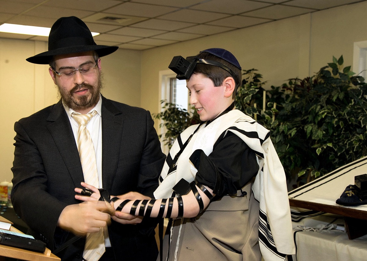 Wrapping tefillin at a bar mitzvah, photographed by VIP Pro Lab and Video